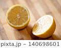 Lemon cut in two halves, close up. Fresh citrus laying on the table, yellow fruit, vitamins, good for health concept 140698601