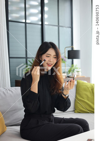 Content creator recording cosmetics review vlog for social media. Content creator recording cosmetics review vlog for social media. 140698753
