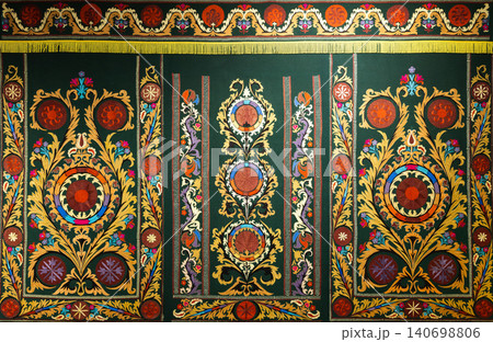 Luxurious ornate embroidered tapestry featuring symmetrical floral medallions Luxurious ornate embroidered tapestry featuring symmetrical floral medallions 140698806