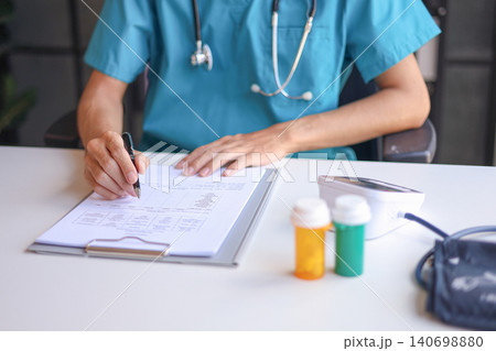 Doctor or authorized medical professional orders a specific medication for a patient to treat an illness or injury. Doctor or authorized medical professional orders a specific medication for a patient to treat an illness or injury. 140698880