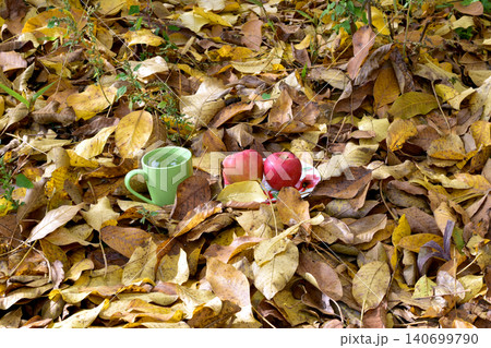 Autumn. Yellow leaves and a cup of tea. 140699790