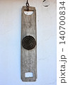 Antique Wooden Flax Comb or Carding Tool Hanging on White Wall 140700834