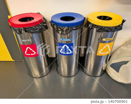 Metal recycling bins with color coded lids for waste separation 140700901