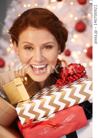 Woman, portrait and Christmas tree with present box for holiday giving with season celebration, event or packaging. Female person, face and excited for vacation break with gift, giveaway or prize 140700921