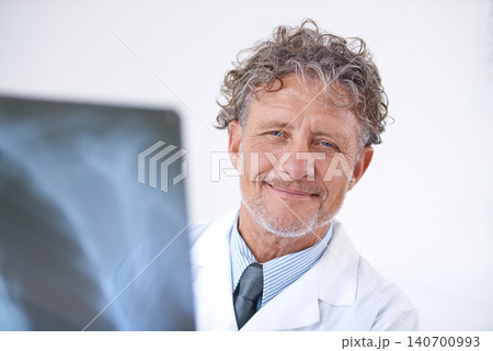 Senior man, doctor and portrait with xray for healthcare, injury analysis or anatomy with radiology and smile. Mature, face or health expert or happy for diagnosis or confidence for results in clinic Senior man, doctor and portrait with xray for healthcare, injury analysis or anatomy with radiology and smile. Mature, face or health expert or happy for diagnosis or confidence for results in clinic 140700993