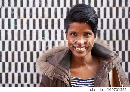 Woman, portrait and smile with jacket, happiness and urban style with optimism. Person, fashion and excited for winter, satisfaction and positive natural beauty on trendy checkered wall background Woman, portrait and smile with jacket, happiness and urban style with optimism. Person, fashion and excited for winter, satisfaction and positive natural beauty on trendy checkered wall background 140701321