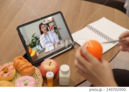 Telehealth nutrition consultation online for wellness remote healthcare with doctor on tablet patient 140702000