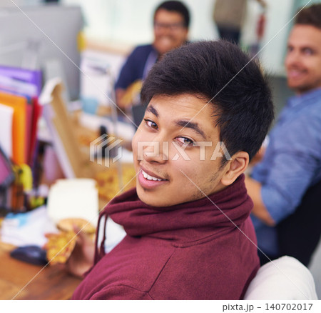 Businessman, portrait and eating with smile in office for lunch break, pizza and coworking company. Programmer, asian employee and face or happiness with fast food, coding team and working at desk Businessman, portrait and eating with smile in office for lunch break, pizza and coworking company. Programmer, asian employee and face or happiness with fast food, coding team and working at desk 140702017