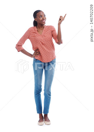 Black woman, happy and point in studio with thinking for choice, news announcement or option. African female person, smile and hand with gesture for direction, opportunity or idea on white background 140702209