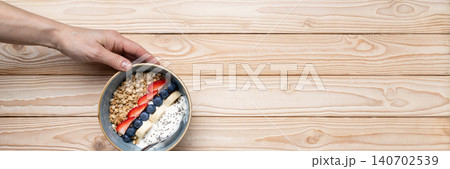 Healthy breakfast granola yogurt bowl berries Healthy breakfast granola yogurt bowl berries 140702539