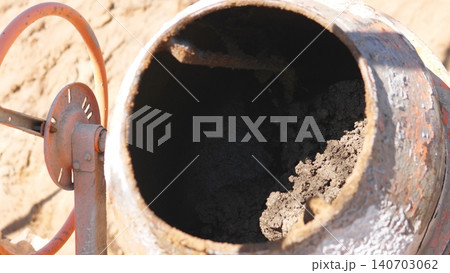 Mixer Drum Details. Dark Interior With Residue Patches. Weathered Steel And Corrosion With Abstract Shadows. Deep Shadow Creates Abstract Opening In Weathered Steel Surface 140703062