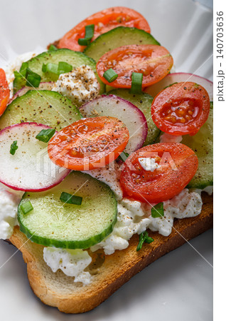 Vegetable toast with cucumber tomato radish and cottage cheese. Healthy homemade breakfast and vegetarian snack concept. 140703636