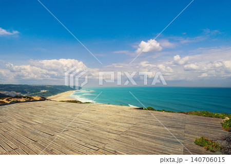 The wooden platform for paragliding flight. Rocky seashore in sunny day. Victory Walls Beach (Praia de Paredes da Vitoria). Pataias, Portugal, Europe The wooden platform for paragliding flight. Rocky seashore in sunny day. Victory Walls Beach (Praia de Paredes da Vitoria). Pataias, Portugal, Europe 140706015