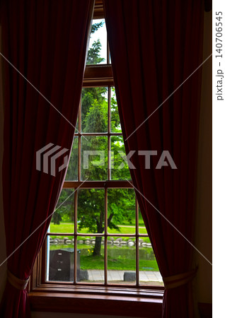 Looking from window with beautiful scene, the garden view with trees. A public park outsides. Nature concept. 140706545