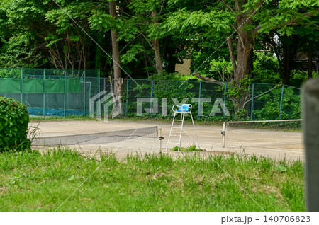 The scene of tennis court in a public park in Japan. Tennis court outdoor in the daytime. Travel and nature scene. The scene of tennis court in a public park in Japan. Tennis court outdoor in the daytime. Travel and nature scene. 140706823