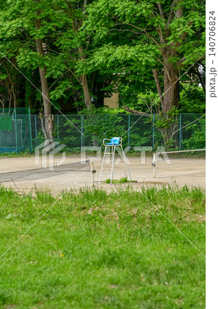 The scene of tennis court in a public park in Japan. Tennis court outdoor in the daytime. Travel and nature scene. The scene of tennis court in a public park in Japan. Tennis court outdoor in the daytime. Travel and nature scene. 140706824