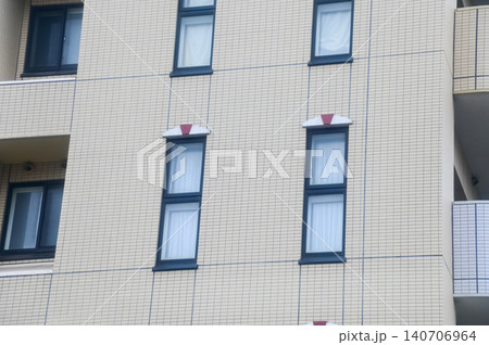 Close-up of the building from the view of street in Sapporo, Hokkaido, Japan. Building exterior. Background use. Cityscape and travel scene. Close-up of the building from the view of street in Sapporo, Hokkaido, Japan. Building exterior. Background use. Cityscape and travel scene. 140706964