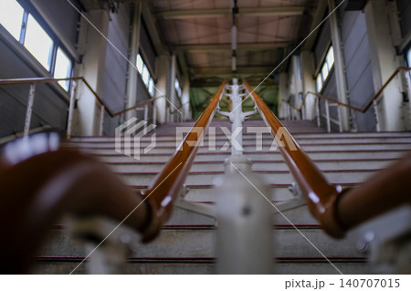Close-up of the concrete stairs. Long stair railings in the station of Sapporo, Hokkaido, Japan. Cityscape and travel concept. 140707015