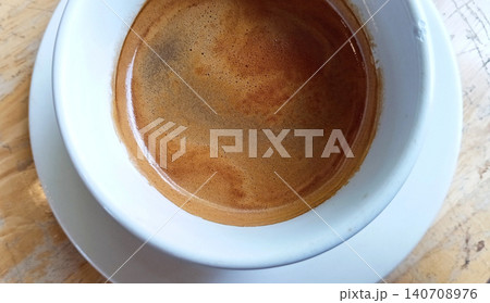 Top view of a cup of bitter black coffee. Top view of a cup of bitter black coffee. 140708976