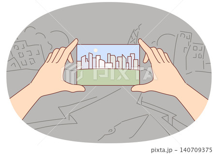Beautiful city in photograph in hands, dreams of sustainable development stands in destroyed quarter Beautiful city in photograph in hands, dreams of sustainable development stands in destroyed quarter 140709375