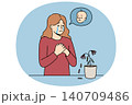 Problem of infertility upsets woman, crying standing near withered flower, and dreaming of child 140709486
