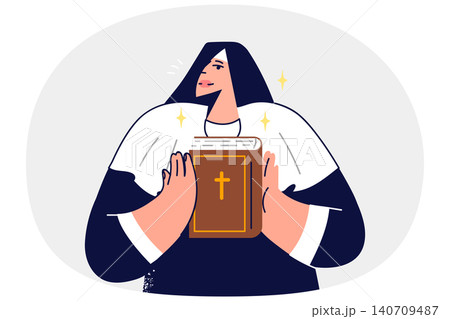 Woman nun holds holy bible in hands and demonstrates main Christian book to parishioners 140709487