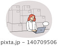 Woman small business owner works sitting near computer and boxes, selling goods through online store 140709506