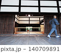 Monk walking through traditional japanese temple architecture 140709891