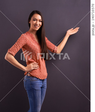Woman, portrait and hand for presentation mockup space for news information for sale, advertising or grey background. Female person, face and discount promotion or showing gesture, studio or option Woman, portrait and hand for presentation mockup space for news information for sale, advertising or grey background. Female person, face and discount promotion or showing gesture, studio or option 140710370