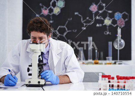 Science, notes and man with microscope for research in chemistry, pathology and university class. Laboratory, investigation and scientist writing report on blood test for medical study with results Science, notes and man with microscope for research in chemistry, pathology and university class. Laboratory, investigation and scientist writing report on blood test for medical study with results 140710554