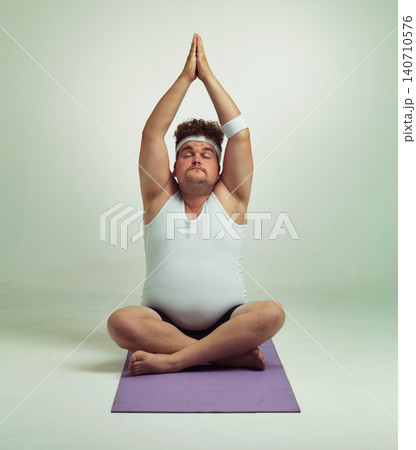Man, plus size and meditation with mat in studio on white background with exercise or stretching for fitness. Healthy, wellness and progress with body positivity for mindset, zen and hands up 140710576