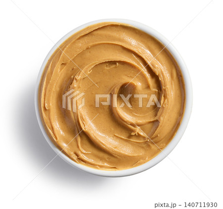 Bowl of Peanut Butter with Swirl Texture Isolated on White Background, Top View Bowl of Peanut Butter with Swirl Texture Isolated on White Background, Top View 140711930