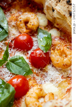 Pizza margarita. Italian dish. Fresh pepperoni food with tomatoes sauce melted cheese mozzarella green basil leaves crispy shrimp. Pizza margarita. Italian dish. Fresh pepperoni food with tomatoes sauce melted cheese mozzarella green basil leaves crispy shrimp. 140712157