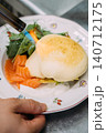 Gas torch. Gourmet breakfast. Chef cooking lunch with professional fire tool. Hand searing sauce with salmon slices green salad leaves. 140712175