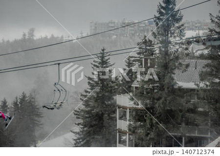 Snowshoe West Virginia Ski Resort in Fog with Chairlift Snow Covered Trees and Low Visibility Snowshoe West Virginia Ski Resort in Fog with Chairlift Snow Covered Trees and Low Visibility 140712374