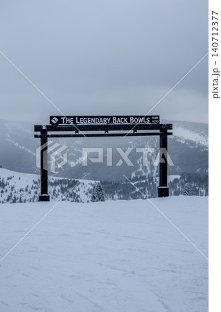 Vail Legendary Back Bowls Sign in Colorado with Snow Covered Mountain Landscape Vail Legendary Back Bowls Sign in Colorado with Snow Covered Mountain Landscape 140712377
