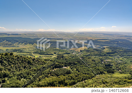 Panoramic view of the green valley and the snowy peak of Mount Elbrus on the horizon against the blue sky on a sunny clear morning in Kislovodsk Stavropol territory, Russia Panoramic view of the green valley and the snowy peak of Mount Elbrus on the horizon against the blue sky on a sunny clear morning in Kislovodsk Stavropol territory, Russia 140712608