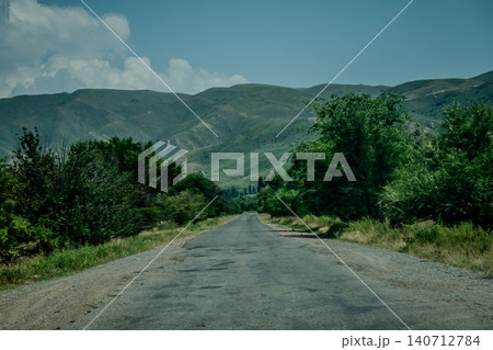 Scenic Mountain Roads and Rural Landscapes Through Valleys and Highlands in Kyrgyzstan Central Asia Scenic Mountain Roads and Rural Landscapes Through Valleys and Highlands in Kyrgyzstan Central Asia 140712784