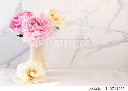 Still life with delicate, beautiful peonies in a vase. Abstract floral arrangement, minimalist abstract background for a product presentation, design template, holiday card idea Still life with delicate, beautiful peonies in a vase. Abstract floral arrangement, minimalist abstract background for a product presentation, design template, holiday card idea 140713055