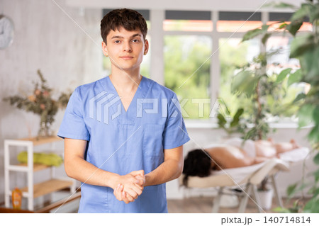 Portrait of happy male masseur in spa salon Portrait of happy male masseur in spa salon 140714814
