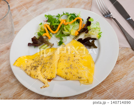 Traditional dish of French cuisine is an omelet Traditional dish of French cuisine is an omelet 140714890