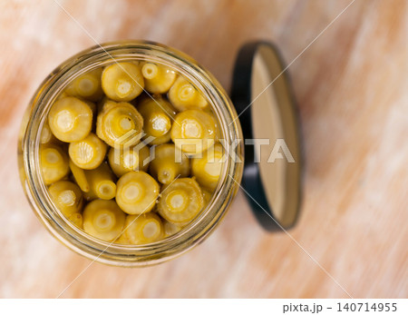 Bunch of pickled okra in opened jar Bunch of pickled okra in opened jar 140714955