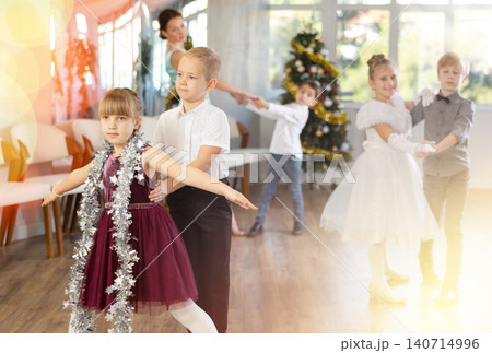 New Year performance - beautifully dressed children dance classical dances at Christmas ball New Year performance - beautifully dressed children dance classical dances at Christmas ball 140714996