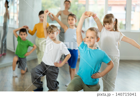Girl paired up with boy, they train to perform slow waltz dance, rehearse performance. 140715041