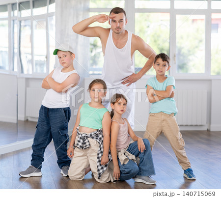 Tweens with instructor having fun in hip hop dance studio 140715069