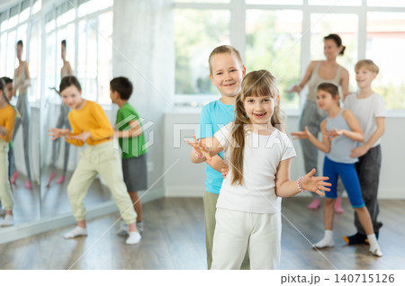 Group of children dancing couple twist dance Group of children dancing couple twist dance 140715126