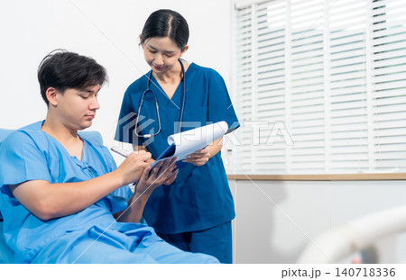 man patient filling insurance legal document at appointment with doctor. Elderly patient signing medical treatment contract, agreement form for taking medic care service, consultation, therapy 140718336