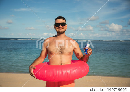 Bali, Indonesia, March 18, 2026: Red Bull drink at the beach Bali, Indonesia, March 18, 2026: Red Bull drink at the beach 140719695