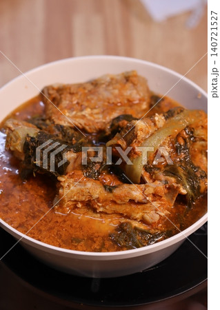 Rich Reddish Stew with Meat and Vegetables in Bowl 140721527