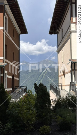 Mountain landscape framed between resort buildings in the Caucasus Mountain landscape framed between resort buildings in the Caucasus 140721528